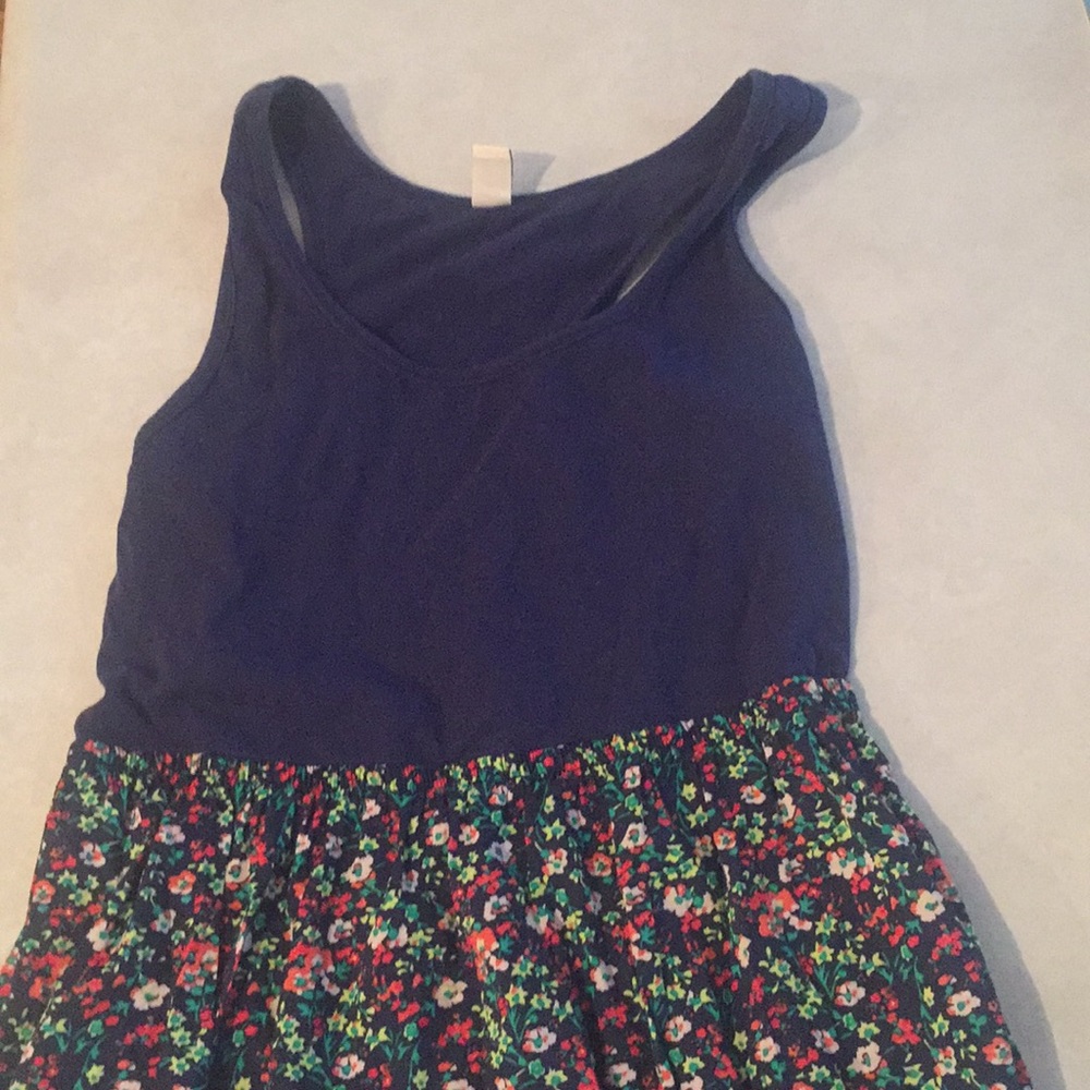 Medium knee length floral and navy dress.
